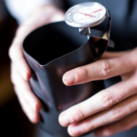 Black Non-Stick Milk Jug in use